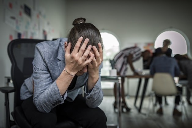 women upset sitting in chair