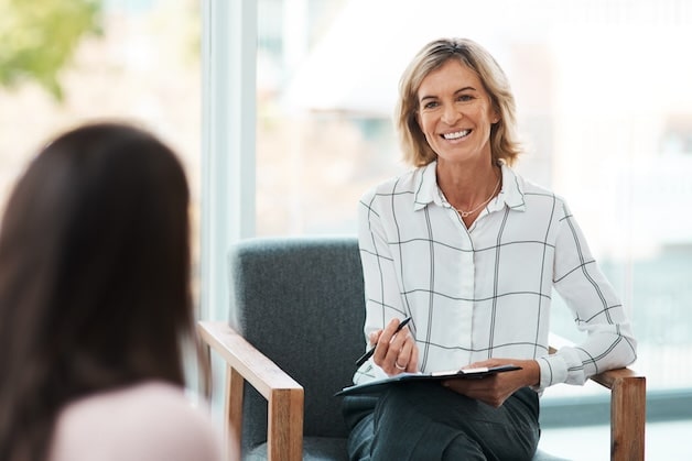 Psychologist having a mental health therapy session with her patient.